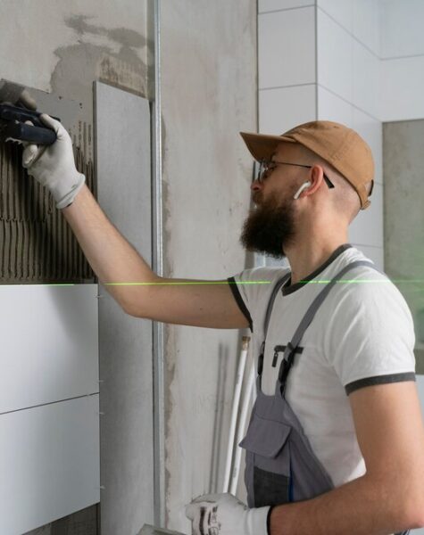 tiler-working-renovation-apartment_23-2149278610 tiler-working-renovation-apartment_23-2149278610